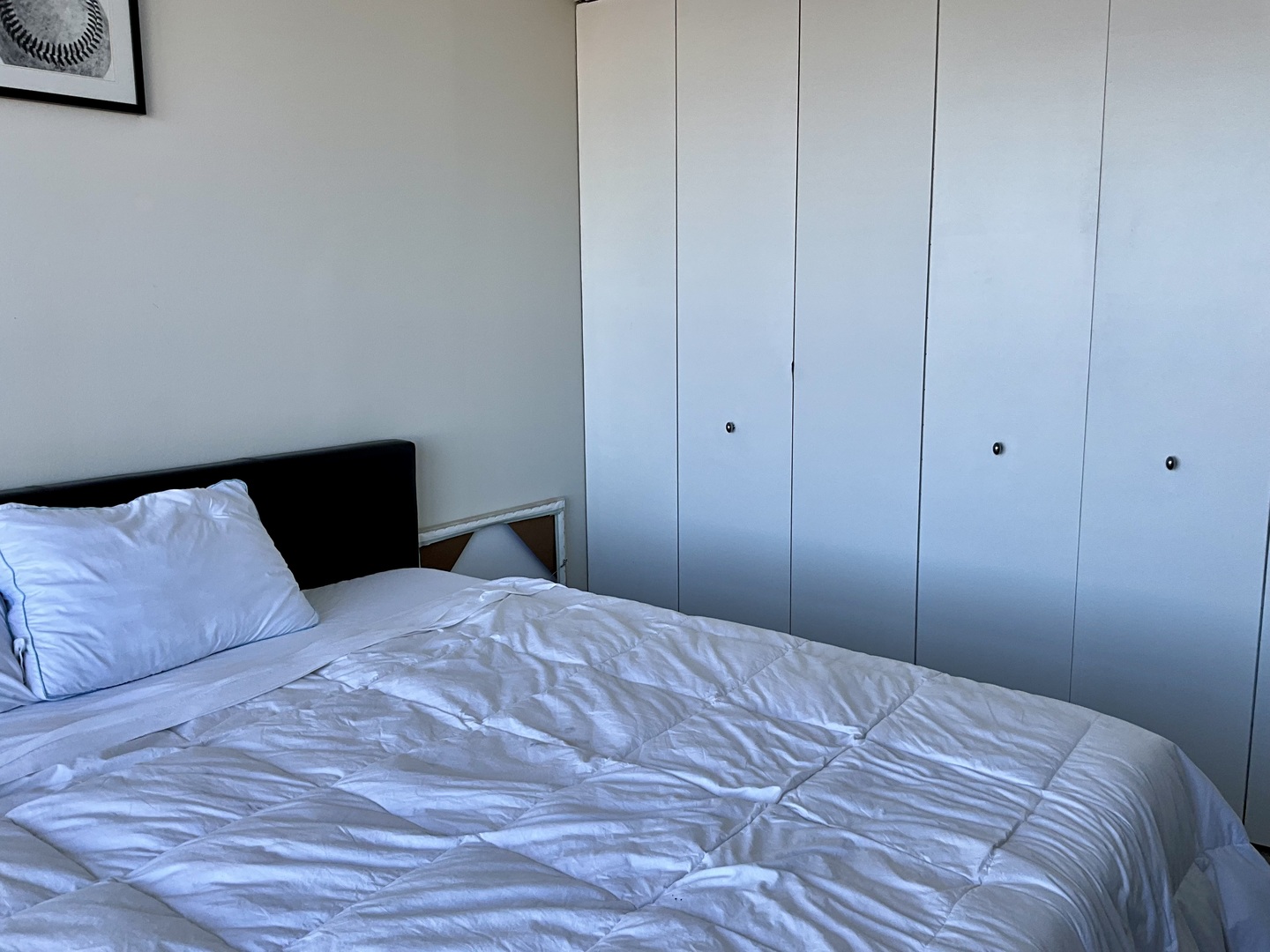 655 West Irving Park Road, Unit 2110 Chicago, IL 60613 - Photo 19 of 38 a bedroom with a bed and a night stand