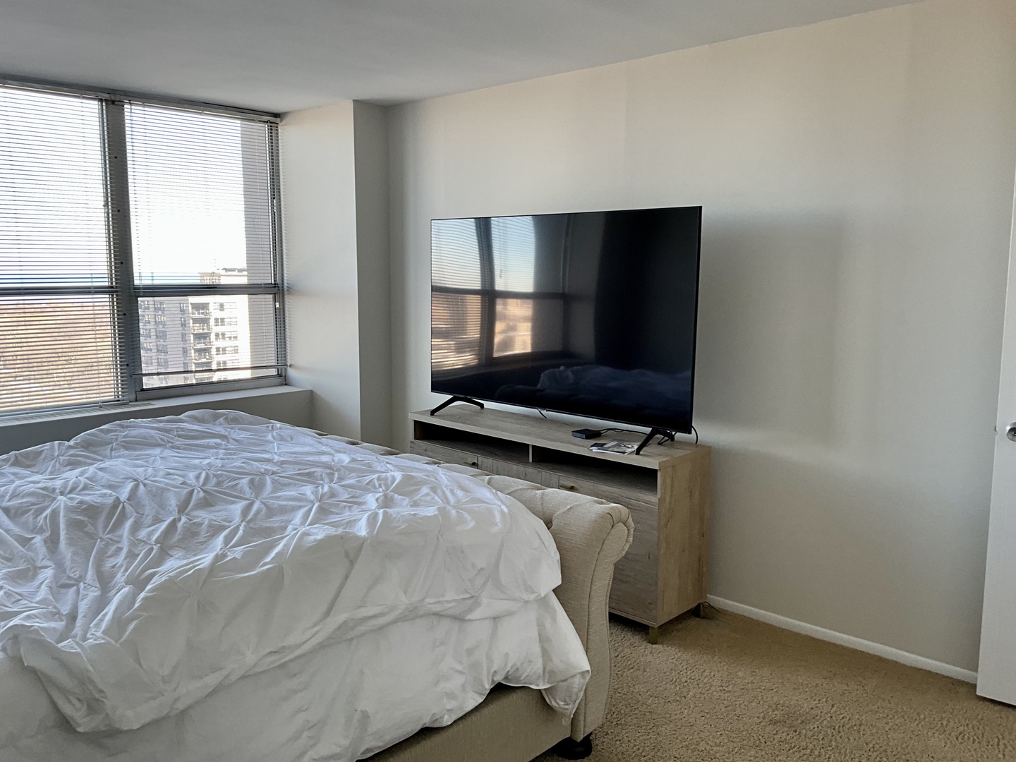 655 West Irving Park Road, Unit 2110 Chicago, IL 60613 - Photo 23 of 38 a bedroom with a bed and a window