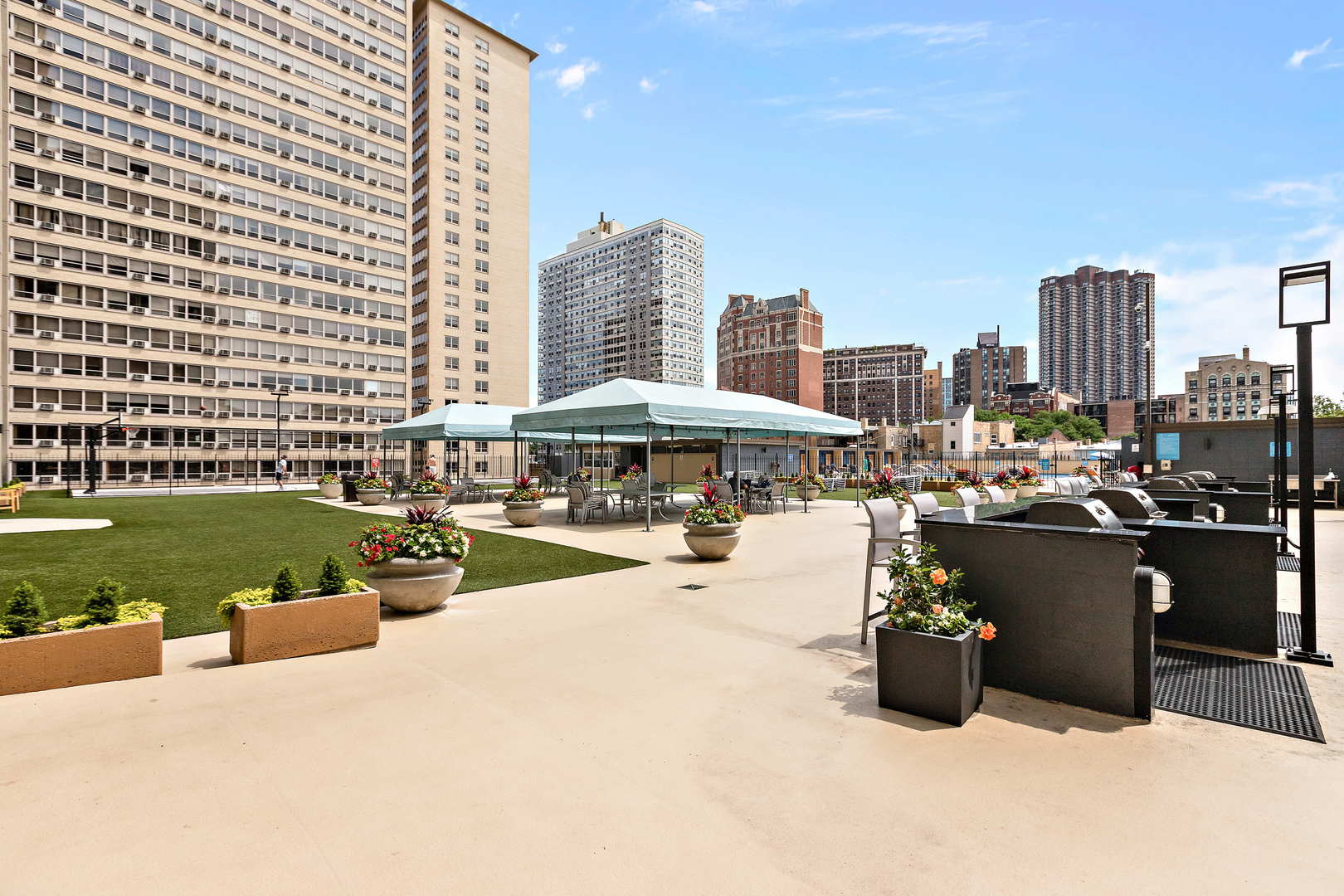 655 West Irving Park Road, Unit 2110 Chicago, IL 60613 - Photo 35 of 38 a view of a swimming pool and lounge chairs