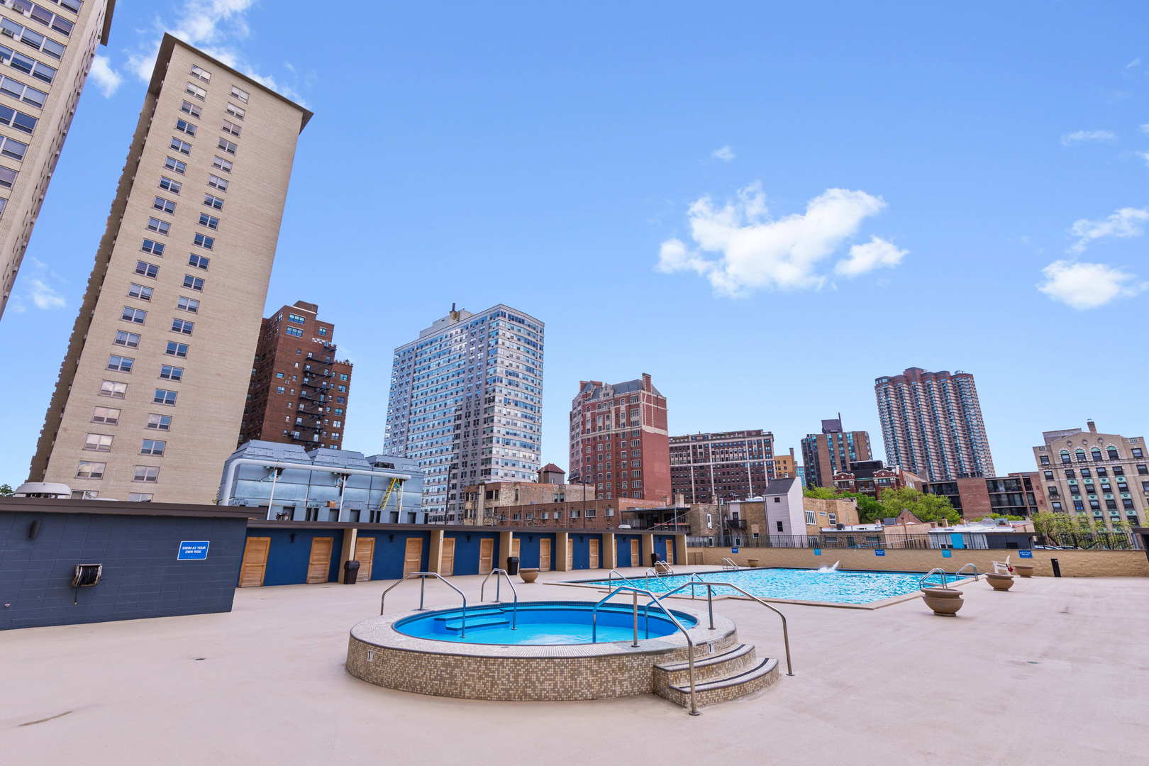 655 West Irving Park Road, Unit 2110 Chicago, IL 60613 - Photo 36 of 38 a dining room with furniture and a chandelier