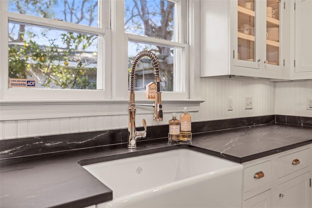 637 Scotland Street Dunedin, FL 34698 - Photo 13 of 72 a kitchen with granite countertop a sink and a stove