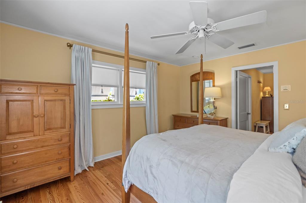 637 Scotland Street Dunedin, FL 34698 - Photo 20 of 72 a bedroom with a bed and a dresser