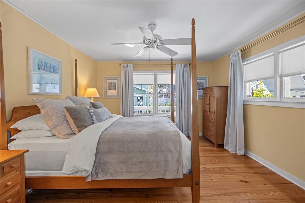 637 Scotland Street Dunedin, FL 34698 - Photo 21 of 72 a bed room with a bed and a chandelier