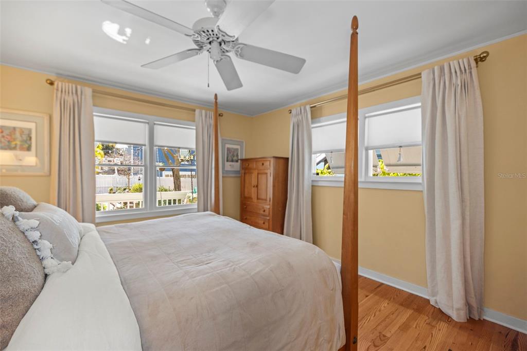 637 Scotland Street Dunedin, FL 34698 - Photo 26 of 72 a bedroom with a large bed and a window