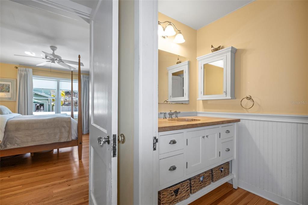 637 Scotland Street Dunedin, FL 34698 - Photo 27 of 72 a bathroom with a sink a mirror and a shower