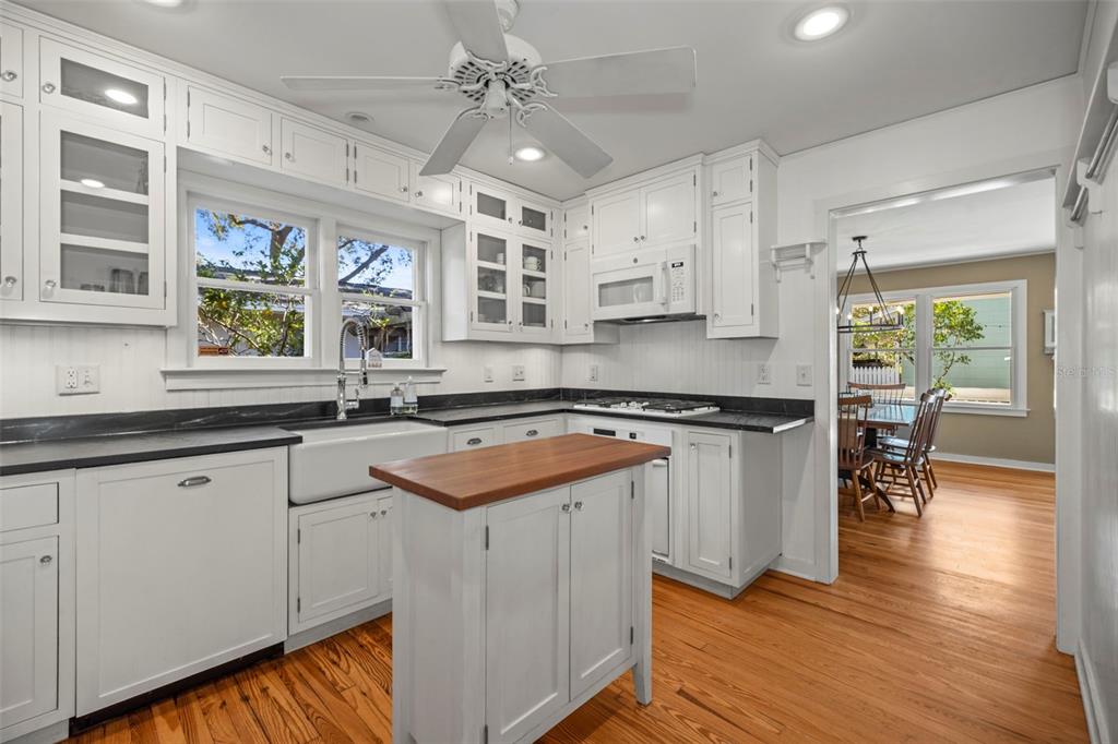 637 Scotland Street Dunedin, FL 34698 - Photo 3 of 72 a kitchen with stainless steel appliances granite countertop a sink and cabinets