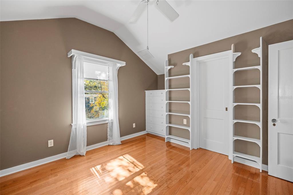 637 Scotland Street Dunedin, FL 34698 - Photo 33 of 72 a view of an empty room with a window and wooden floor