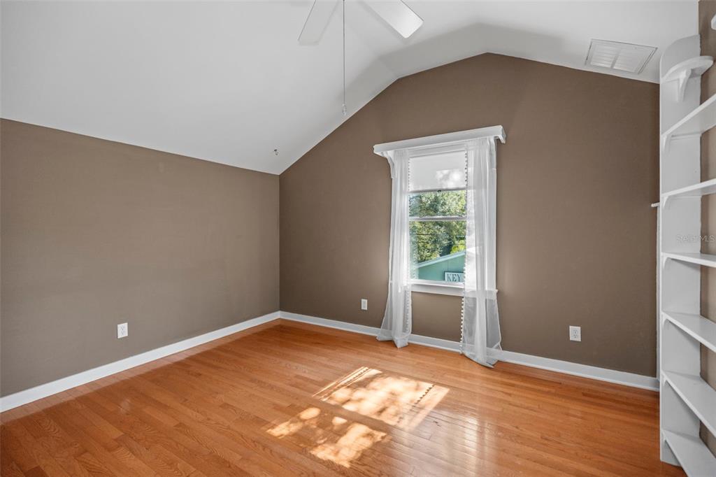 637 Scotland Street Dunedin, FL 34698 - Photo 36 of 72 a view of an empty room with wooden floor and a window