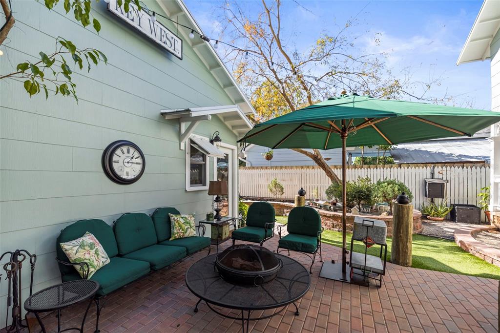 637 Scotland Street Dunedin, FL 34698 - Photo 40 of 72 a view of a backyard with sitting area and furniture