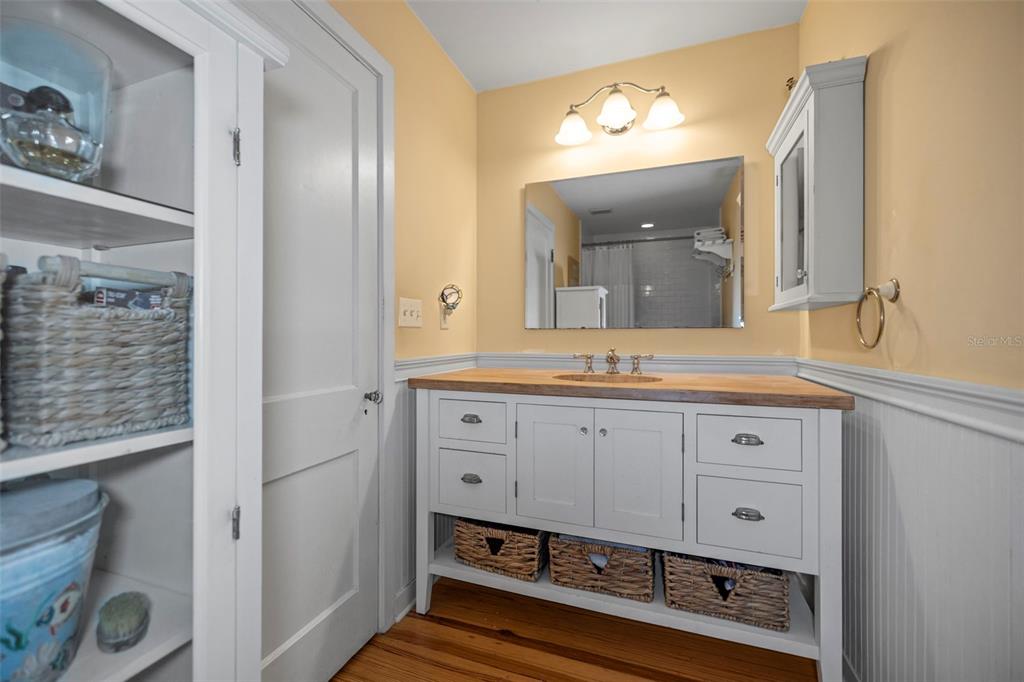 637 Scotland Street Dunedin, FL 34698 - Photo 47 of 72 a bathroom with a sink mirror and vanity