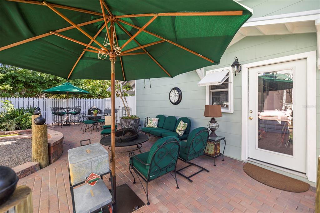 637 Scotland Street Dunedin, FL 34698 - Photo 53 of 72 a view of a two chairs under an umbrella