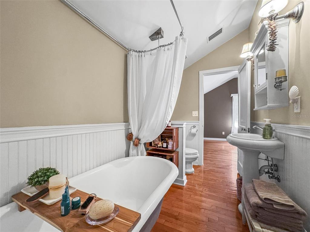 637 Scotland Street Dunedin, FL 34698 - Photo 54 of 72 a living room with furniture and wooden floor