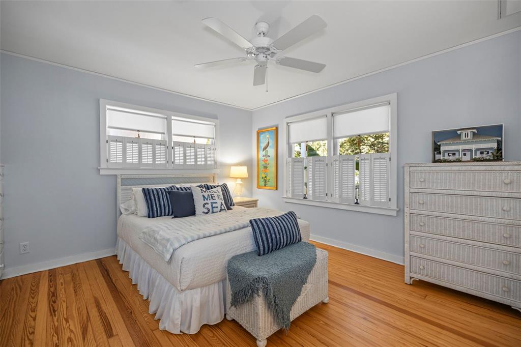 637 Scotland Street Dunedin, FL 34698 - Photo 59 of 72 a spacious bedroom with a bed and a window