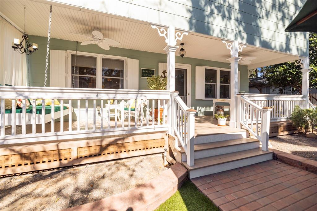 637 Scotland Street Dunedin, FL 34698 - Photo 67 of 72 a view of a house with wooden deck and furniture