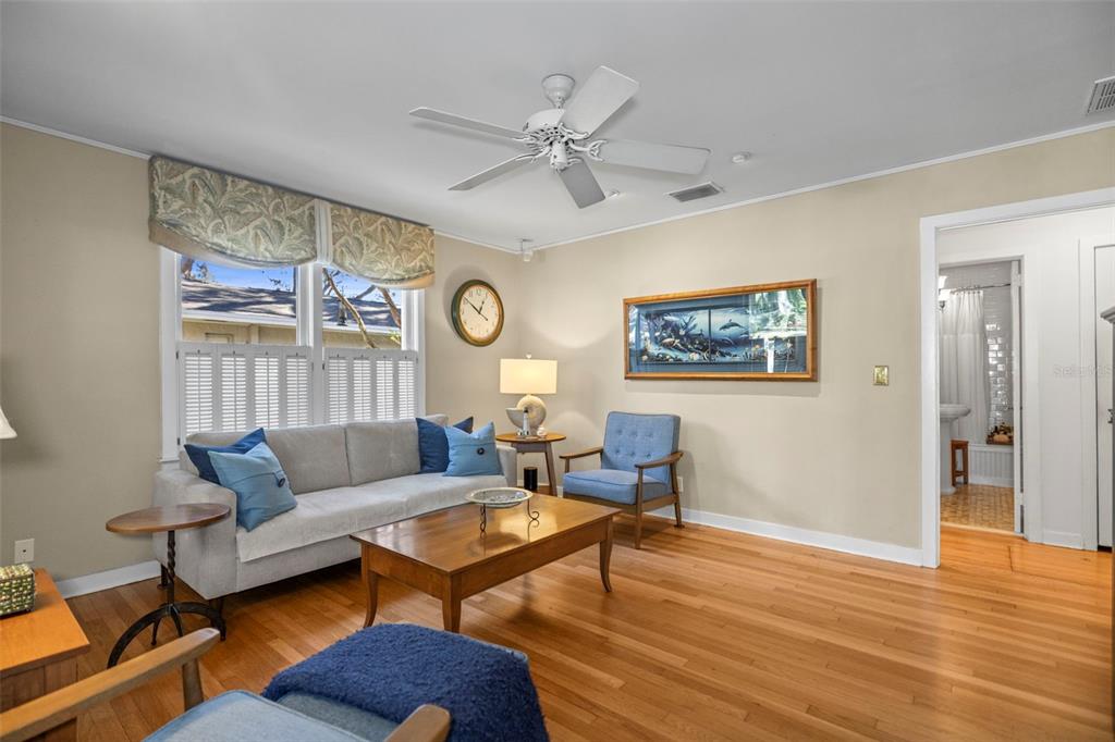 637 Scotland Street Dunedin, FL 34698 - Photo 9 of 72 a living room with furniture and wooden floor