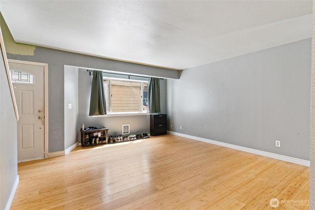 a view of an empty room with a window