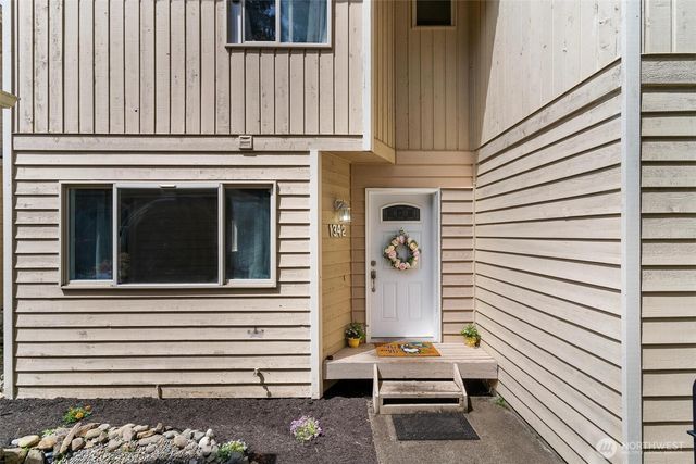 a view of a house with a door and a window