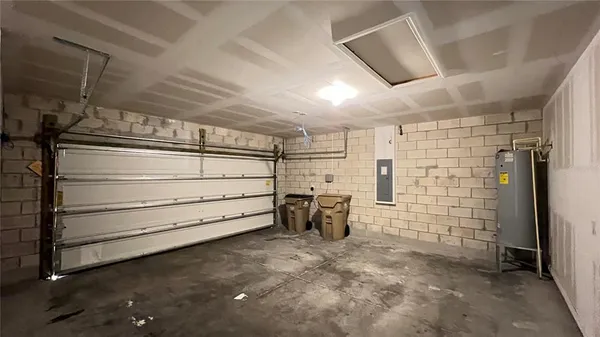 a hallway with white doors wooden floor and glass door