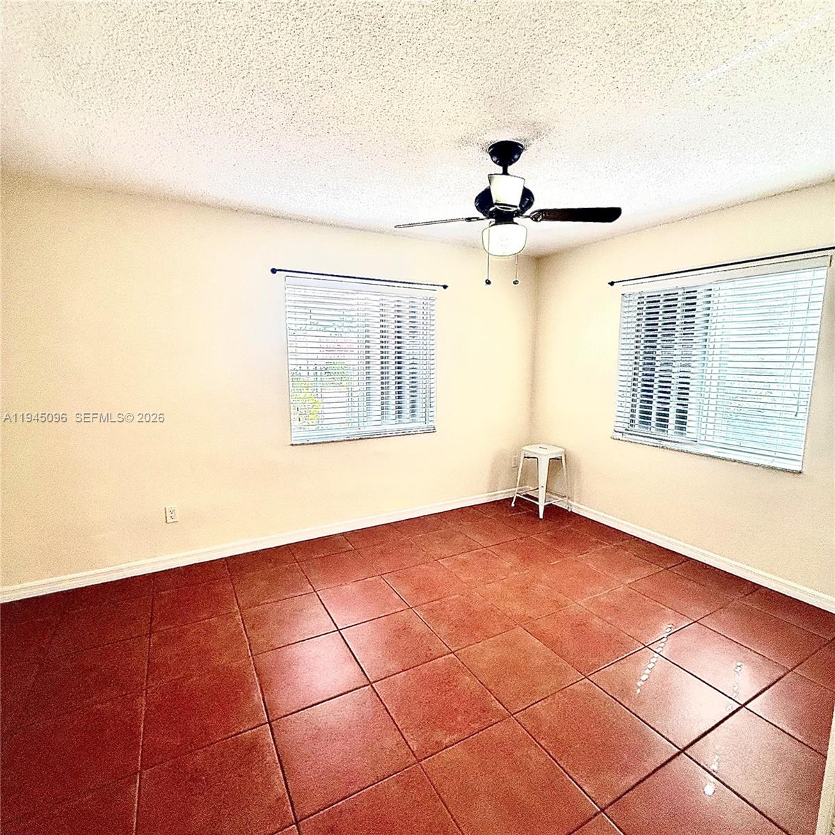 11900 Southwest 6th Street, Unit 2 Miami, FL 33144 - Photo 12 of 14 a view of an empty room with a window