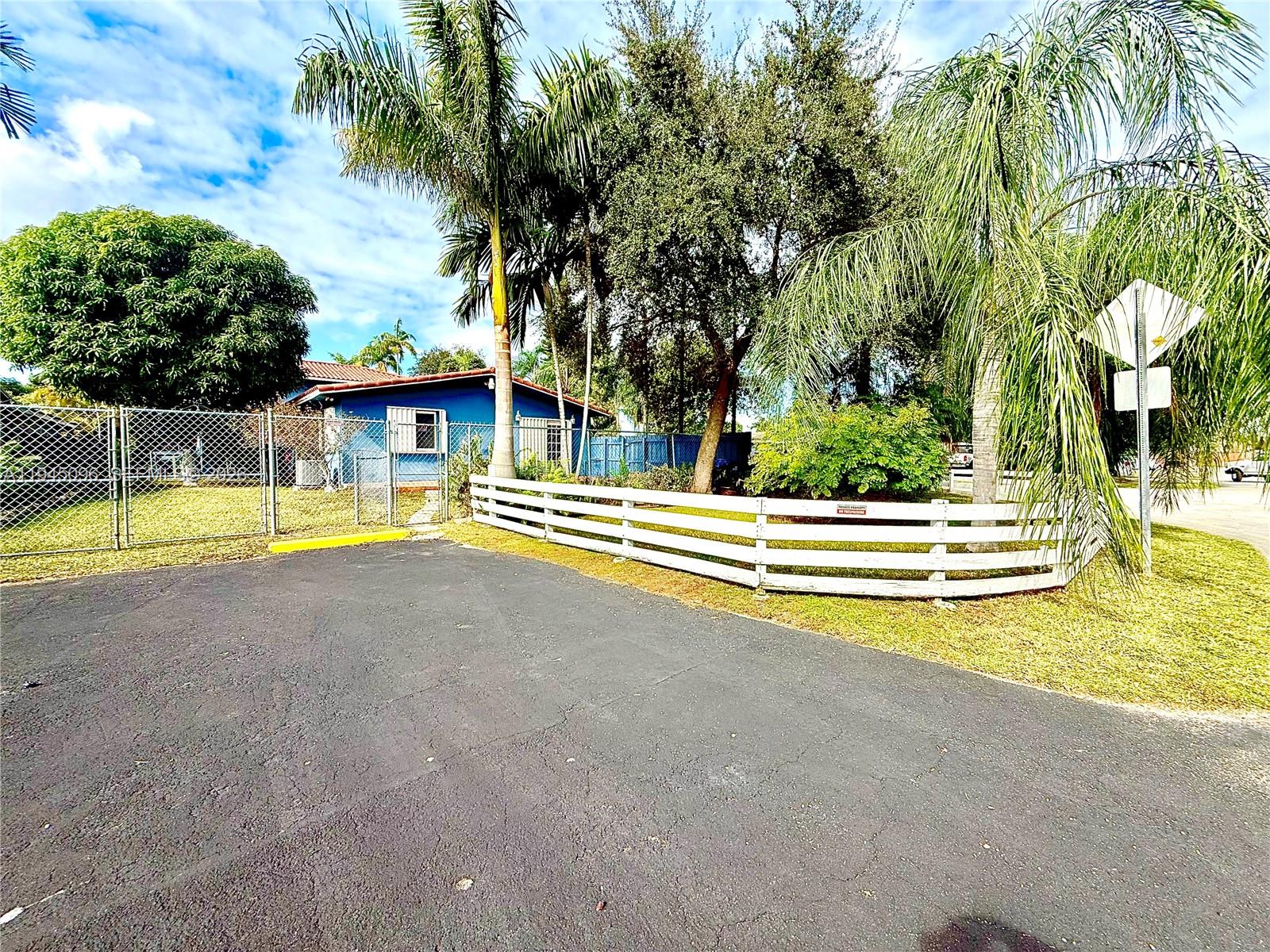 11900 Southwest 6th Street, Unit 2 Miami, FL 33144 - Photo 3 of 14 a view of swimming pool with sitting area and garden