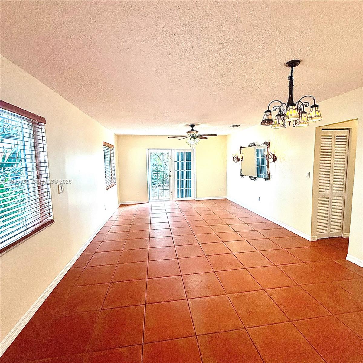 11900 Southwest 6th Street, Unit 2 Miami, FL 33144 - Photo 5 of 14 a view of a livingroom with a flesh screen
