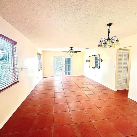 a view of a living room with a large window