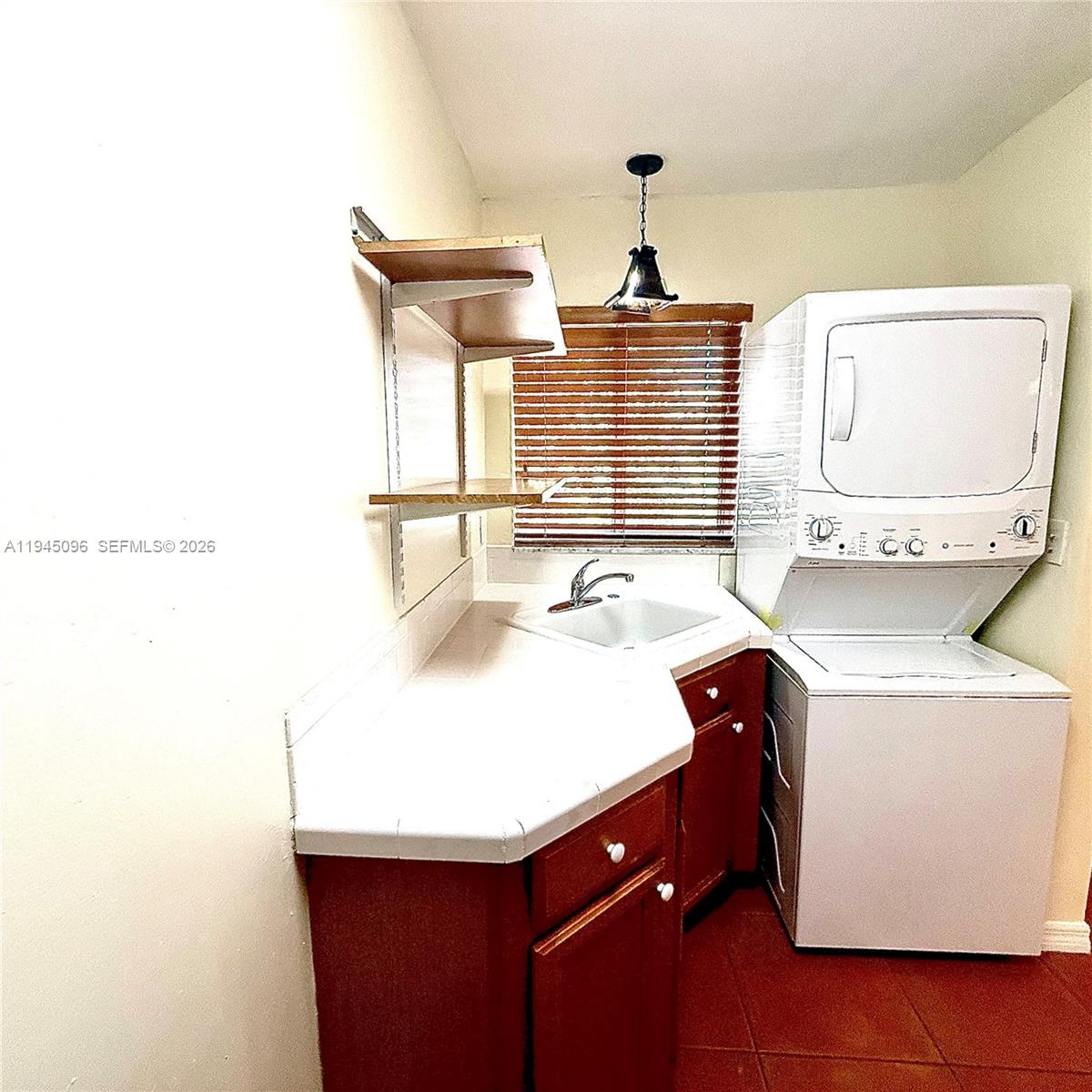 11900 Southwest 6th Street, Unit 2 Miami, FL 33144 - Photo 8 of 14 a bathroom with a sink and a mirror