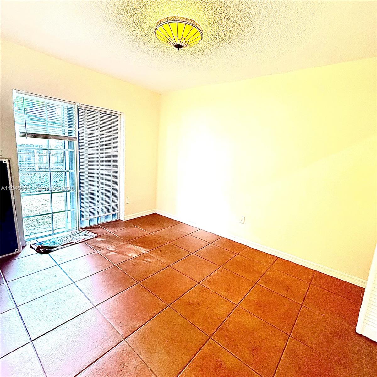 11900 Southwest 6th Street, Unit 2 Miami, FL 33144 - Photo 9 of 14 a view of empty room with windows