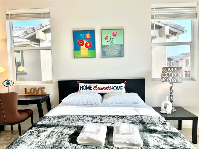 a bedroom with a bed and wooden table