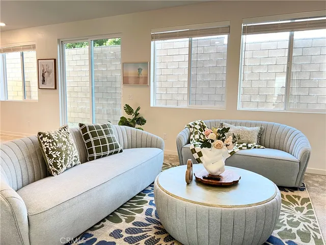 a living room with furniture and window