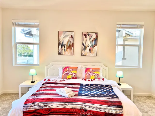 a bedroom with natural light and a window