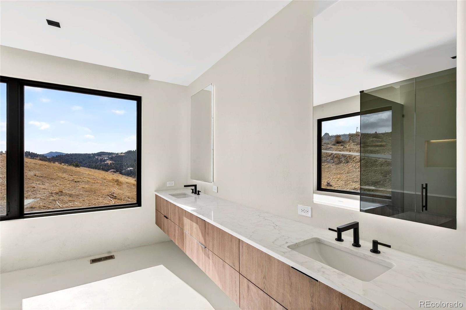 545 Strada Rossa Road Golden, CO 80401 - Photo 16 of 49 a bathroom with a bathtub and a sink