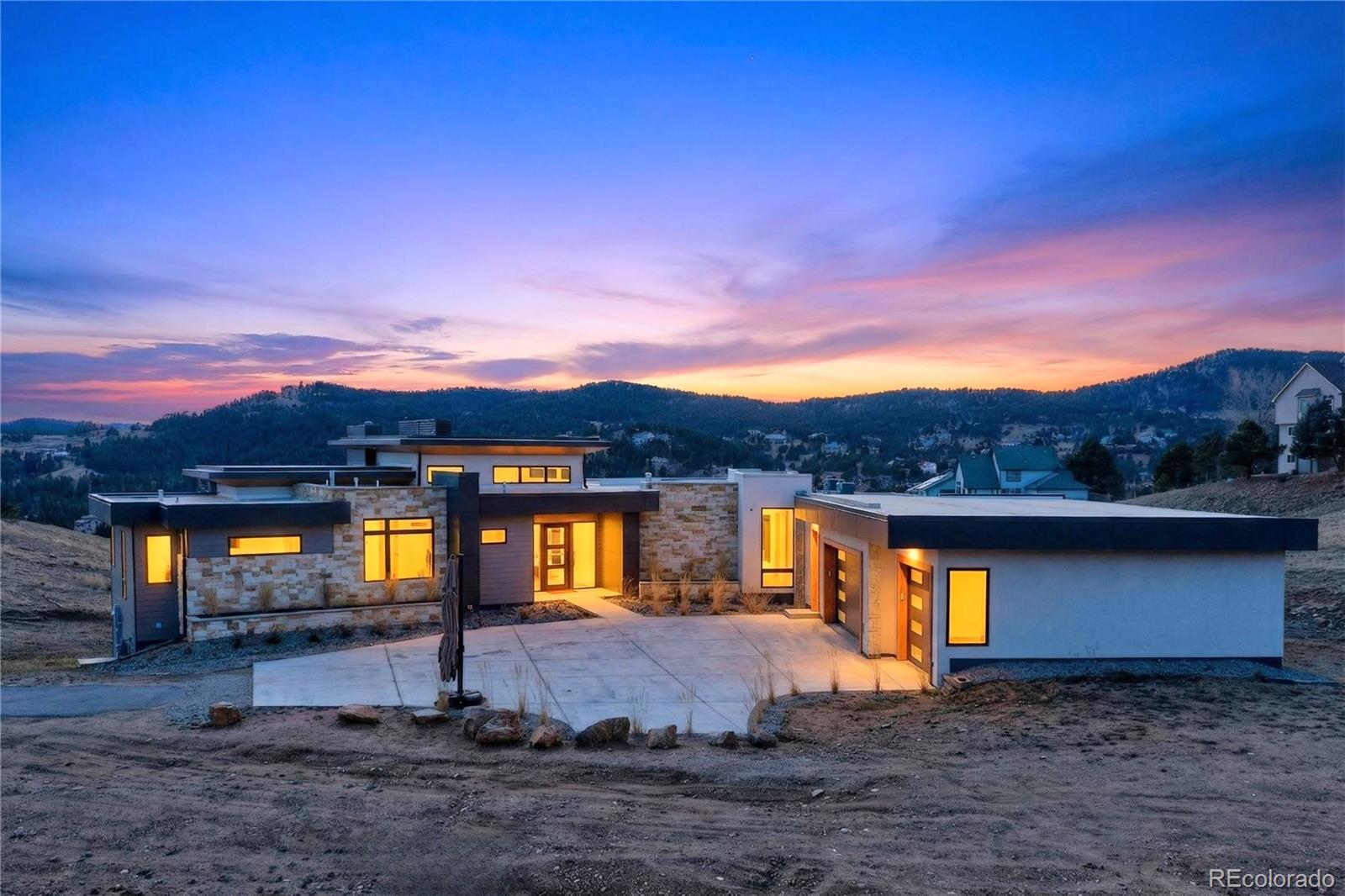 545 Strada Rossa Road Golden, CO 80401 - Photo 2 of 49 a view of a house with a yard