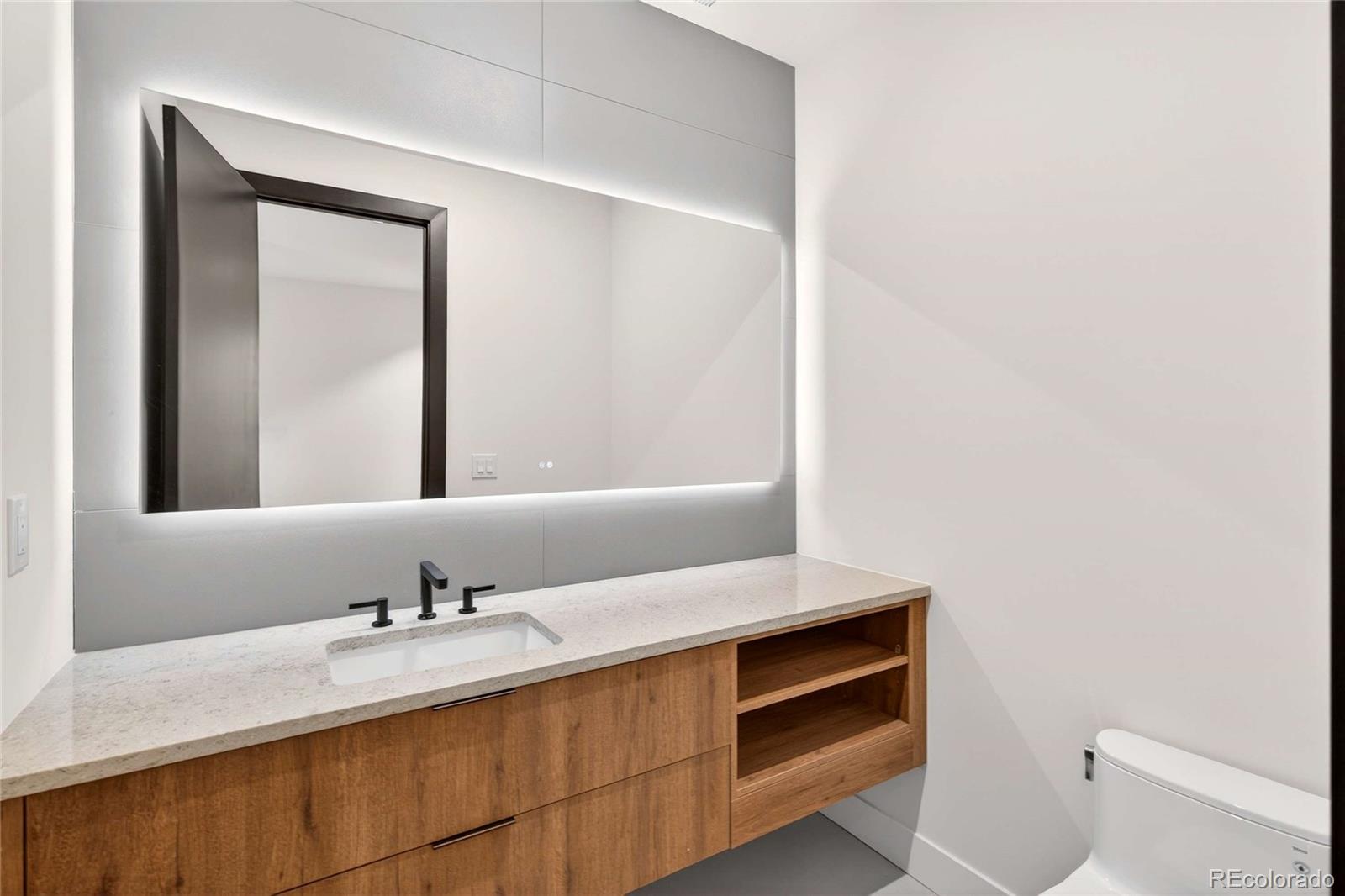 545 Strada Rossa Road Golden, CO 80401 - Photo 21 of 49 a bathroom with a sink and a mirror
