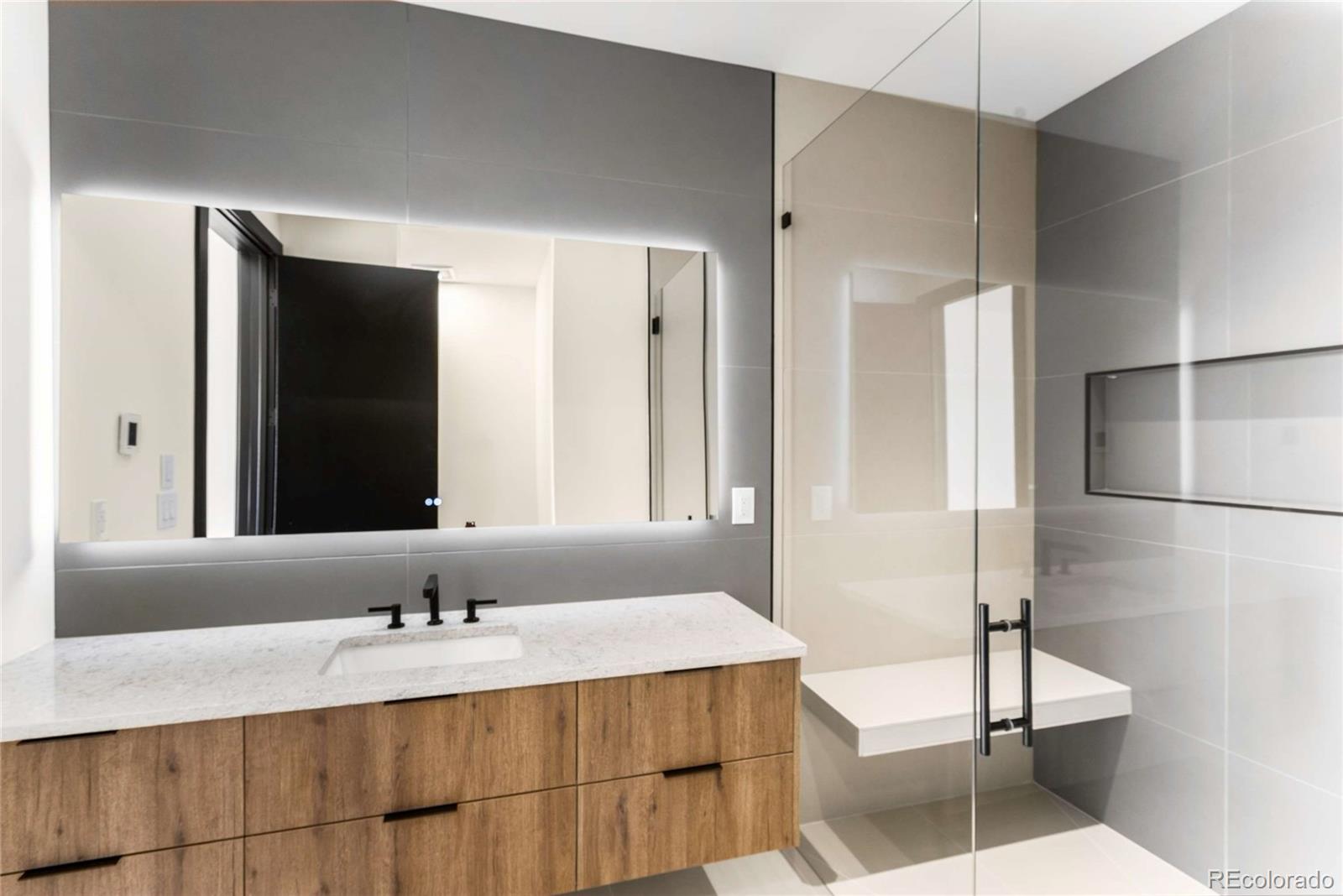 545 Strada Rossa Road Golden, CO 80401 - Photo 25 of 49 a bathroom with a sink and a mirror