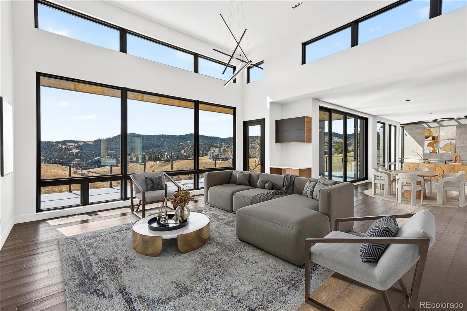 545 Strada Rossa Road Golden, CO 80401 - Photo 6 of 49 a living room with furniture and a large window