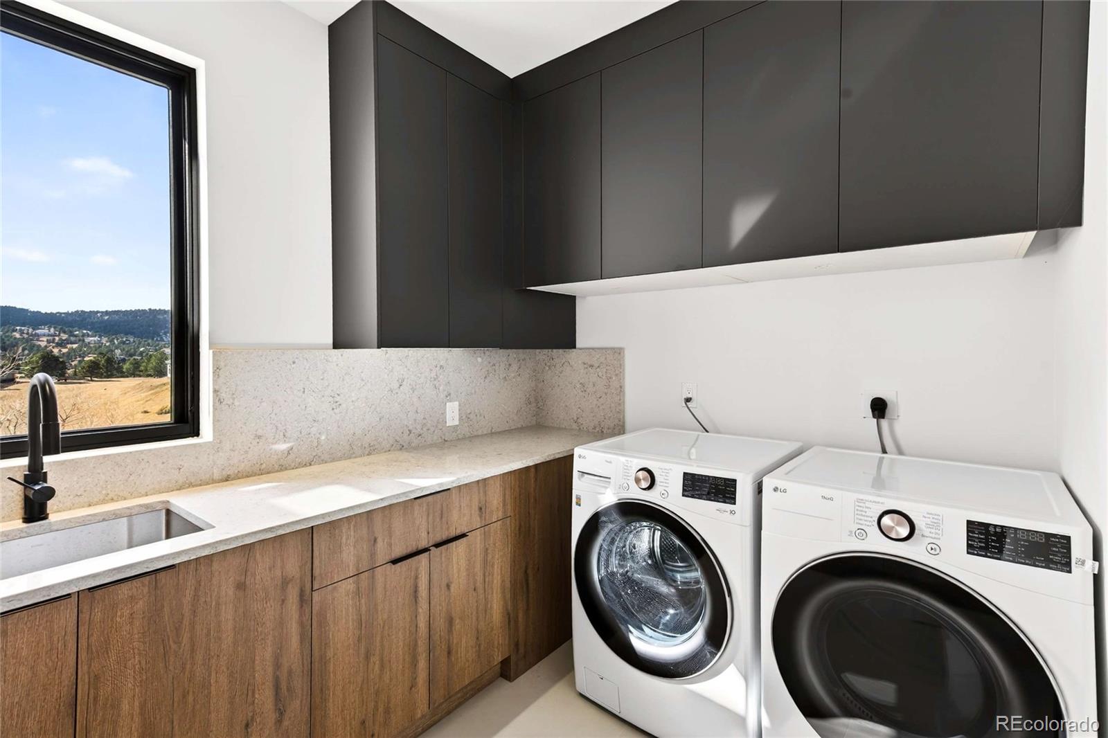 545 Strada Rossa Road Golden, CO 80401 - Photo 8 of 49 a utility room with dryer and washer