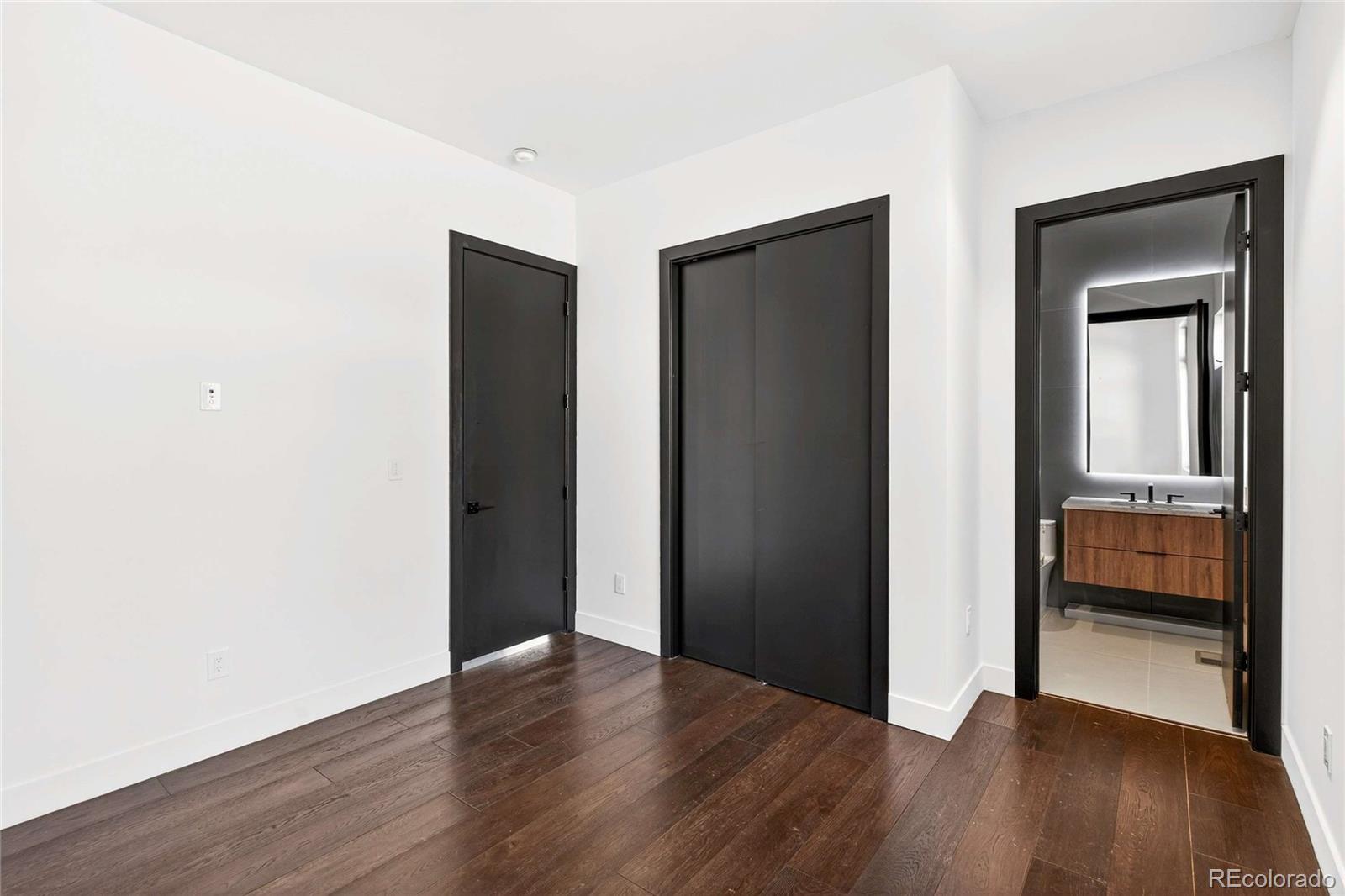 545 Strada Rossa Road Golden, CO 80401 - Photo 10 of 49 a view of a room with wooden floor