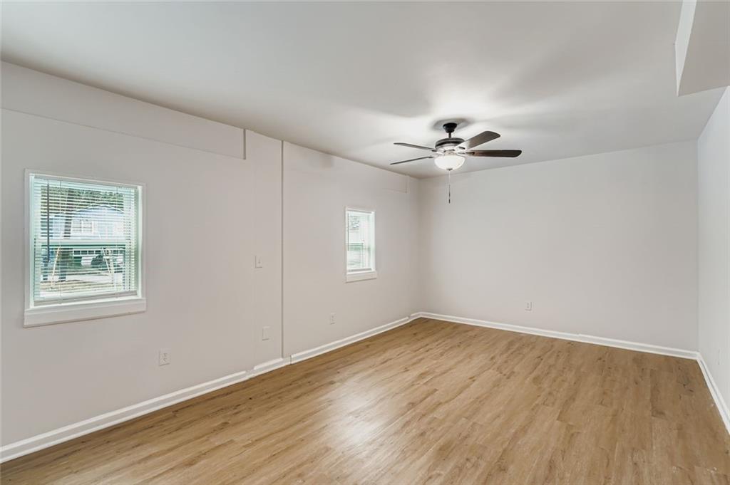 862 Sheppard Way Stone Mountain, GA 30083 - Photo 17 of 22 wooden floor in an empty room with a window