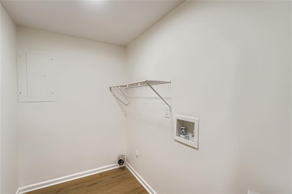 862 Sheppard Way Stone Mountain, GA 30083 - Photo 19 of 22 a view of a room with wall dryer and wooden floor
