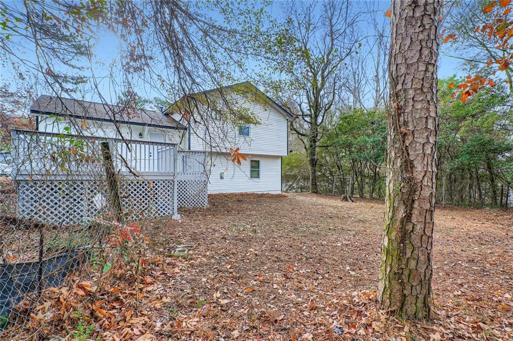 862 Sheppard Way Stone Mountain, GA 30083 - Photo 21 of 22 a view of a house with a yard