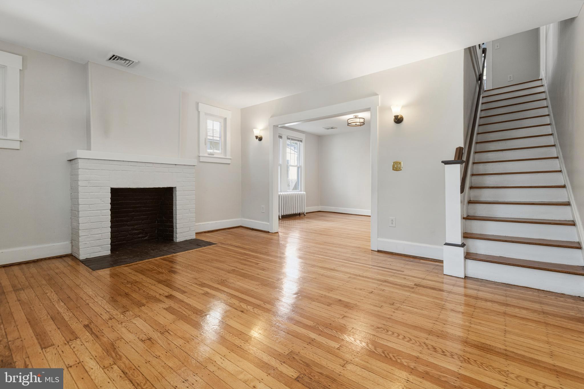 229 Wayne Avenue Narberth, PA 19072 - Photo 7 of 35 a view of a livingroom with wooden floor and a fireplace