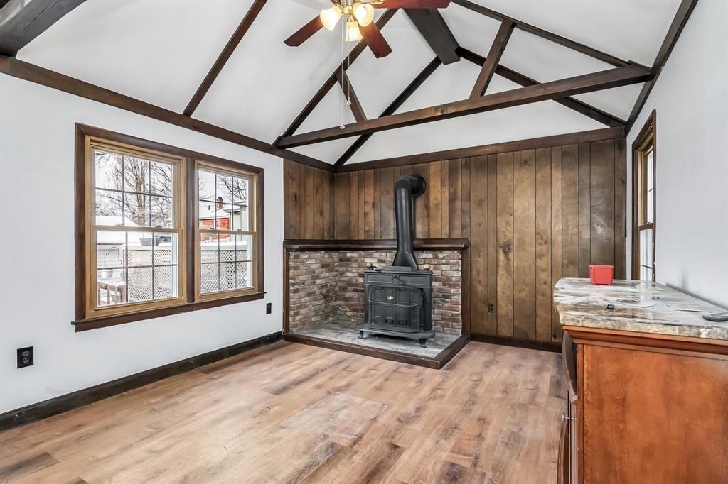 354 Seames Drive Manchester, NH 03103 - Photo 4 of 30 wooden floor in an empty room with a fireplace