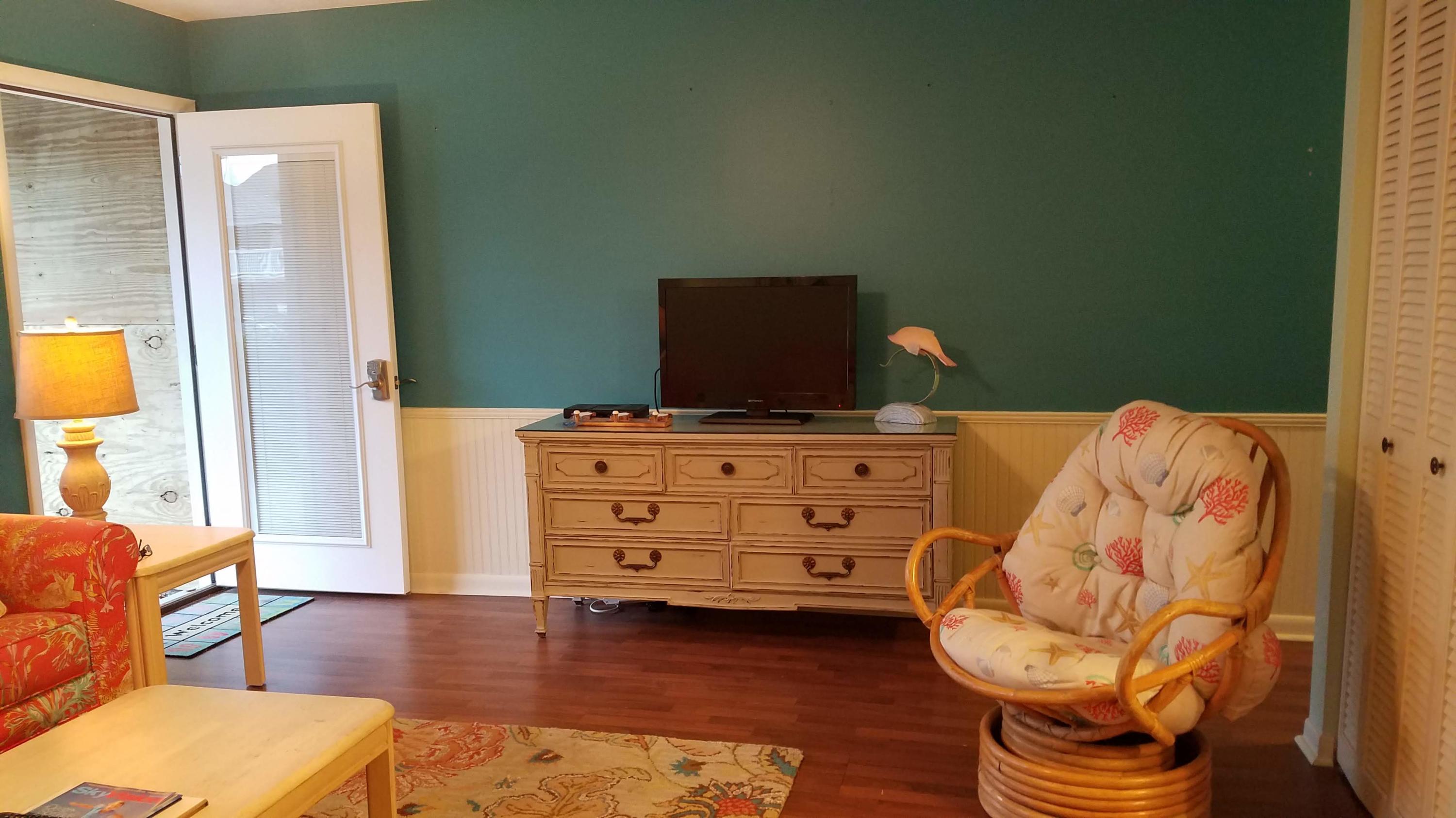 17670 Front Beach Road, Unit D3 Panama City Beach, FL 32413 - Photo 2 of 12 a bedroom with a bed and furniture