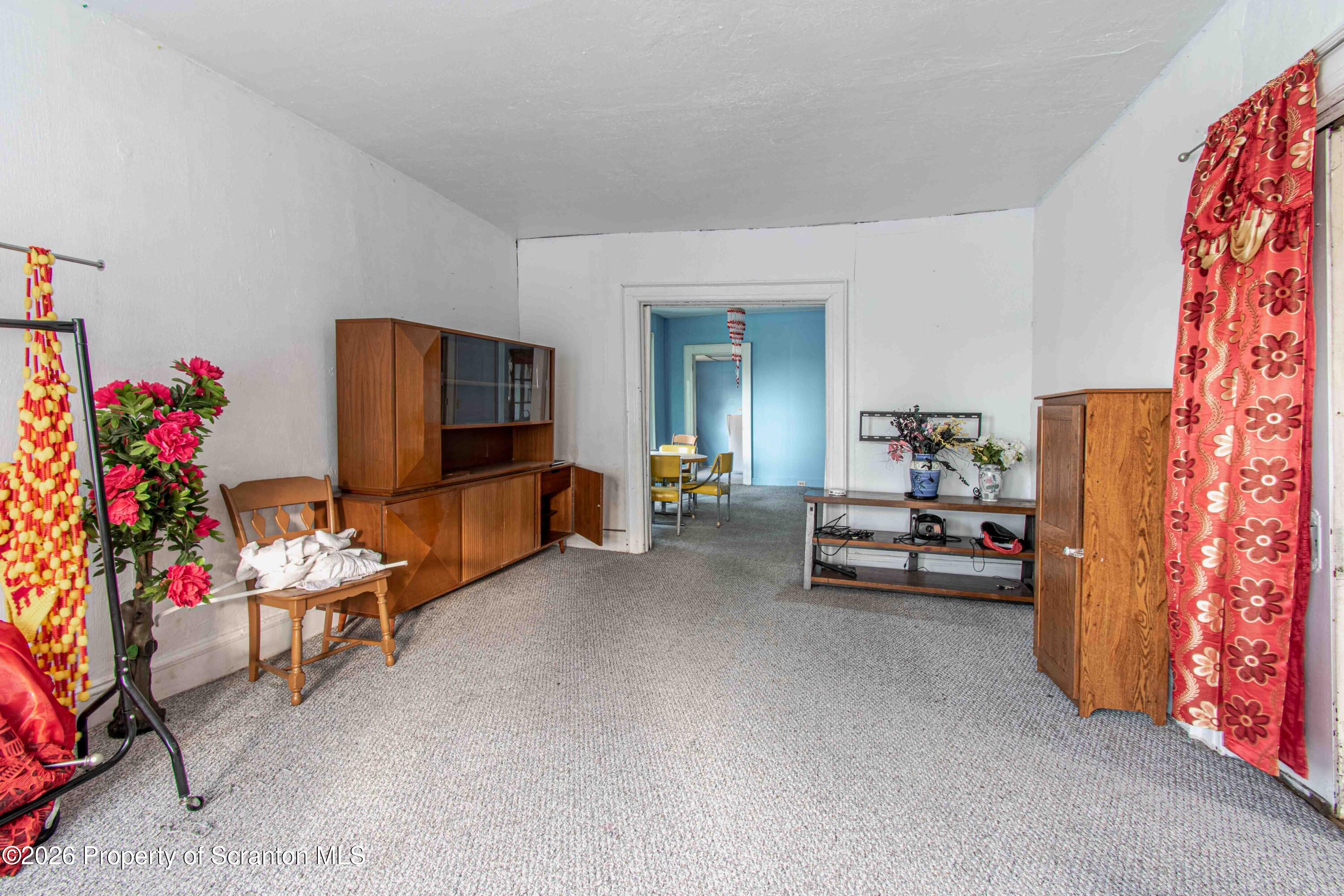 844 Monroe Avenue, Unit 844 Scranton, PA 18510 - Photo 3 of 15 a living room with furniture and a flat screen tv