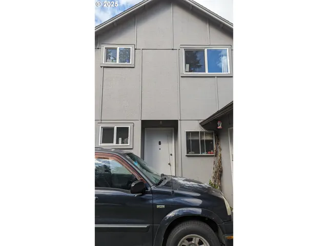 a car parked in front of a house