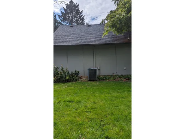a backyard of a house with lots of green space
