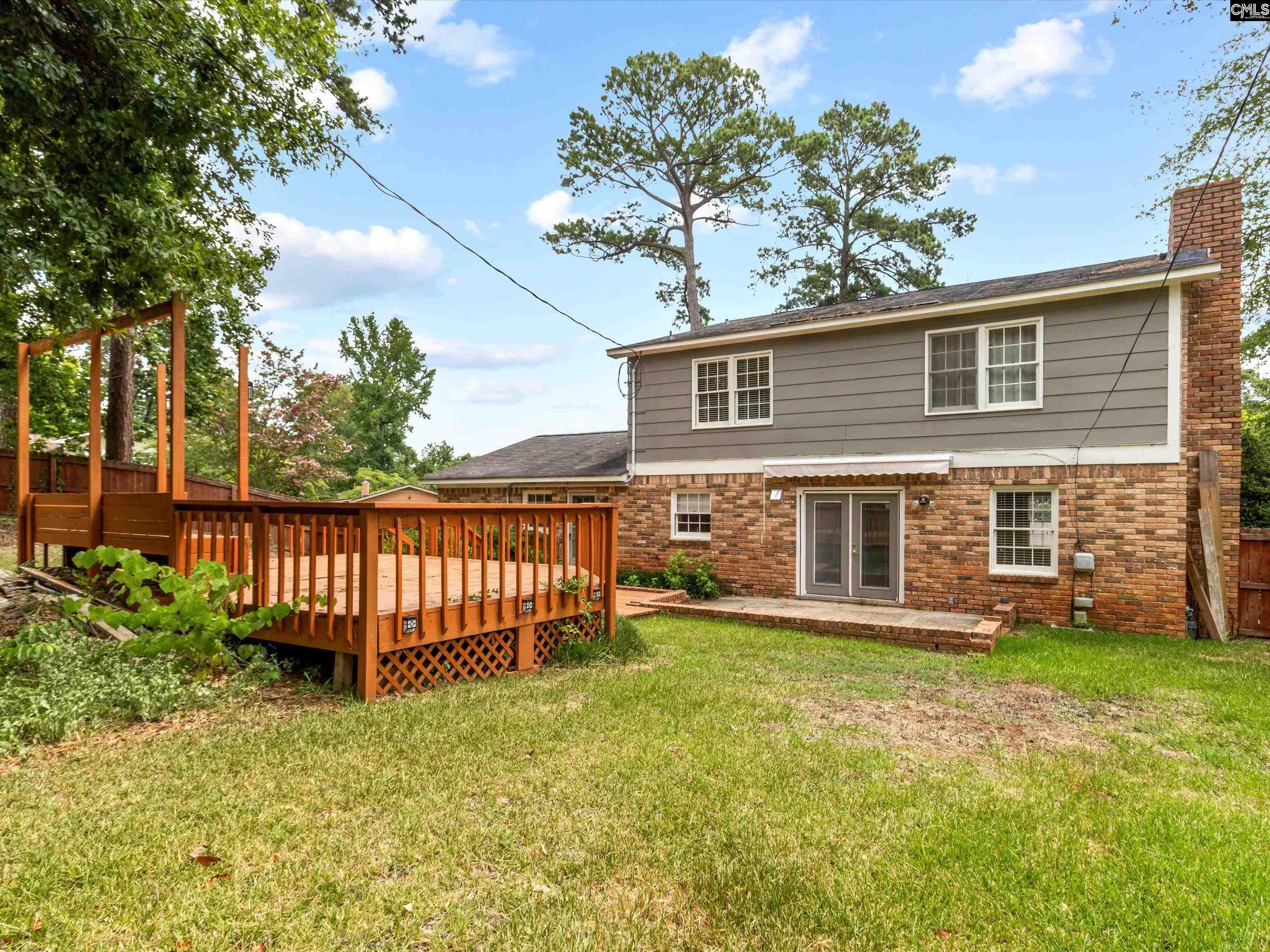 333 Lewisham Road Columbia, SC 29210 - Photo 32 of 35 a view of a house with a yard and a garden