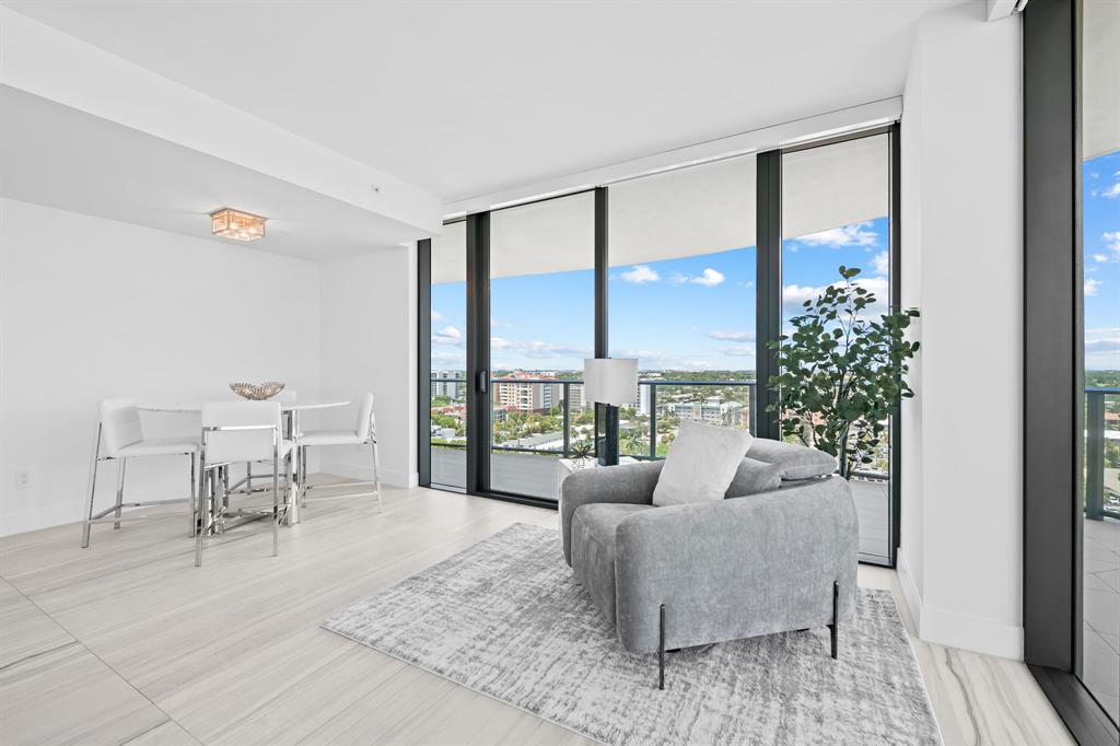 730 North Ocean Boulevard, Unit 1201 Pompano Beach, FL 33062 - Photo 27 of 40 a living room with furniture and a large window
