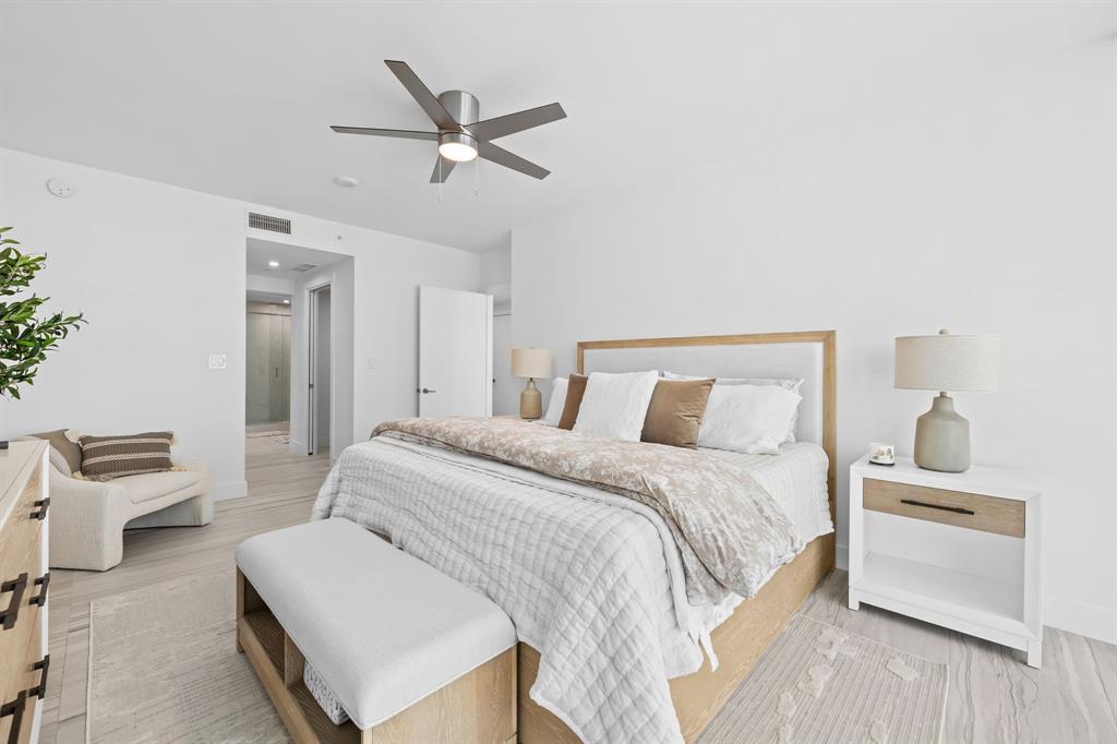 730 North Ocean Boulevard, Unit 1201 Pompano Beach, FL 33062 - Photo 35 of 40 a bedroom with a bed and a chandelier